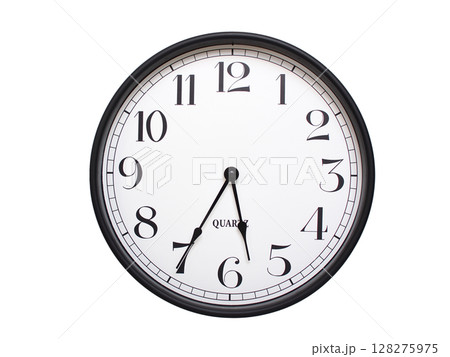 Round analog wall clock with a black frame, white face, and bold black numerals. showing  05:35 or 17:35. Isolated on a white background. Ideal for time-related themes. 128275975