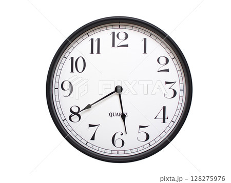 Round analog wall clock with a black frame, white face, and bold black numerals. showing  05:40 or 17:40. Isolated on a white background. Ideal for time-related themes. 128275976
