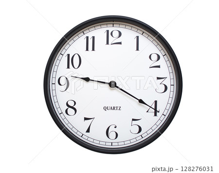 Round analog wall clock with a black frame, white face, and bold black numerals. showing  09:20 or 21:20. Isolated on a white background. Ideal for time-related themes. 128276031