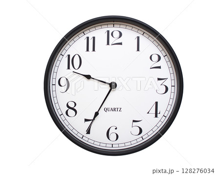 Round analog wall clock with a black frame, white face, and bold black numerals. showing  09:35 or 21:35. Isolated on a white background. Ideal for time-related themes. 128276034