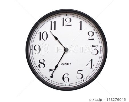 Round analog wall clock with a black frame, white face, and bold black numerals. showing  10:35 or 22:35. Isolated on a white background. Ideal for time-related themes. 128276046