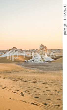 White rock formations and sand dunes in Egypt's White Desert, natural desert landscape 128276210