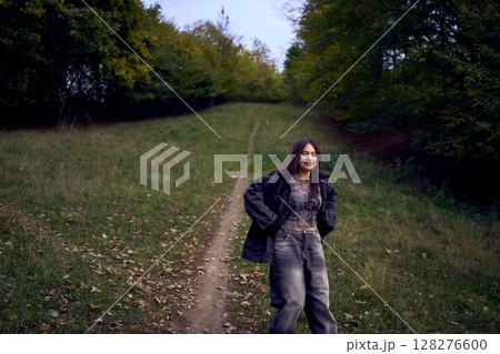 two 15-year-old teenagers in love play, hug, spend time together in an autumn park two 15-year-old teenagers in love play, hug, spend time together in an autumn park 128276600