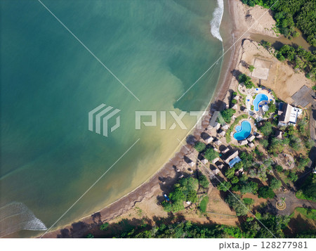 Tropical beach with blue hotel pools Tropical beach with blue hotel pools 128277981