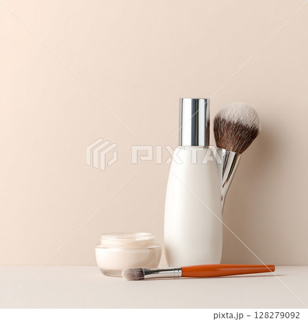 Cosmetic Bottle and Makeup Brush on Soft Toned Background  Skincare and Beauty Concept 128279092