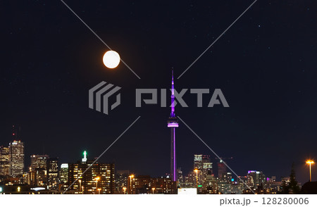 Downtown Toronto skyline with moon at night Downtown Toronto skyline with moon at night 128280006
