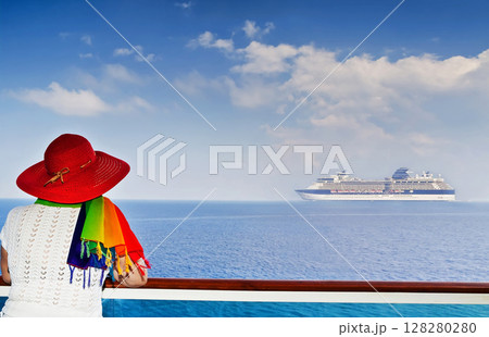 Lady on the ship looking at cruise ship sailing from port Lady on the ship looking at cruise ship sailing from port 128280280