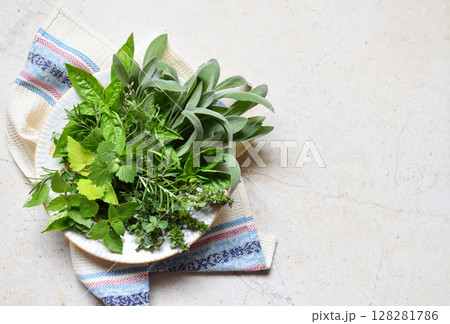 Fresh spicy and medicinal herbs on white background. Bouquet from various herb - rosemary, oregano, sage, marjoram, basil, thyme, mint. 128281786
