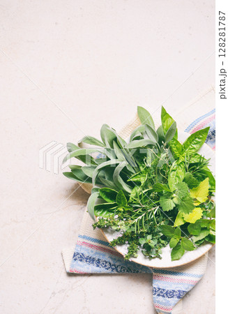 Fresh spicy and medicinal herbs on white background. Bouquet from various herb - rosemary, oregano, sage, marjoram, basil, thyme, mint. 128281787