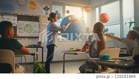 Primary School Children Studying Renewable Energy and Solar System in Modern Multiethnic Classroom 128281869