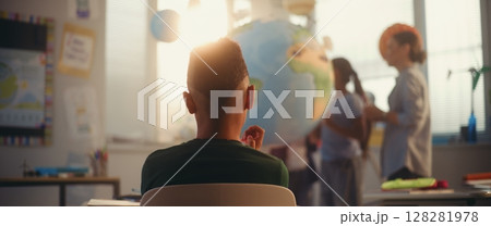 STEM Class: Female Teacher Explaining Energy Resources to Elementary School Students Using Earth Model STEM Class: Female Teacher Explaining Energy Resources to Elementary School Students Using Earth Model 128281978