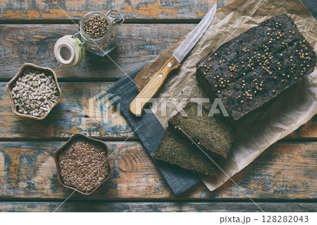 Apple bread loaf from sunflower seeds, chia and flax seeds. Homemade baking. Paleo diet. Organic healthy vegetarian food. Gluten free. Dairy free. Grain free Apple bread loaf from sunflower seeds, chia and flax seeds. Homemade baking. Paleo diet. Organic healthy vegetarian food. Gluten free. Dairy free. Grain free 128282043