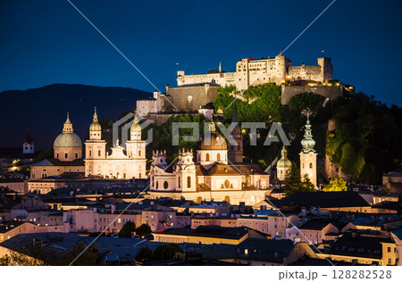 Great view from the top on an evening city shining in the lights. Location famous place (unesco heritage) Festung Hohensalzburg, Salzburger Land, Austria, Europe. Beauty world. Great view from the top on an evening city shining in the lights. Location famous place (unesco heritage) Festung Hohensalzburg, Salzburger Land, Austria, Europe. Beauty world. 128282528