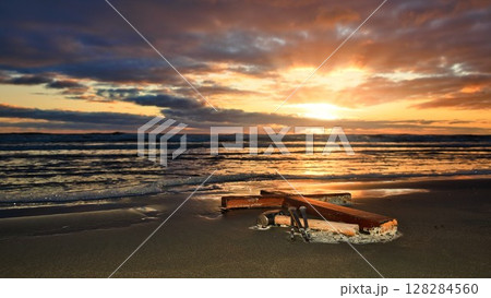 Laid Down Cross With Hammer & Nails Setting Sun Beach 128284560