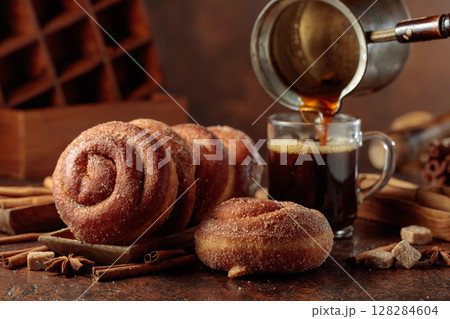 Swedish cinnamon rolls and black coffee. 128284604
