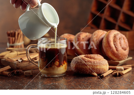 Swedish cinnamon rolls and coffee latte. 128284605