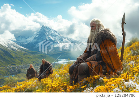 Vikings hike through stunning nature with weapons on a bright sunny day 128284780