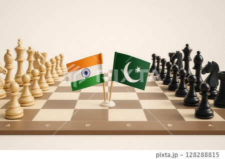 India and Pakistan flags facing each other on a chessboard with full chess pieces 128288815