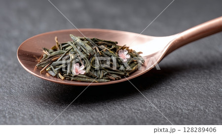 Sencha Green Tea Leaves on Sakura Spoon, Japanese Tea Ceremony Close-Up 128289406