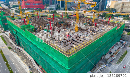 July 6 2025 Large Construction Site with Steel Scaffolding and Tower Cranes 128289792