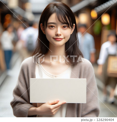 Young Asian Woman Holding Blank Signboard on Traditional Kyoto Old Street for Cultural Tourism and Message Concept with Generative AI. 128290404
