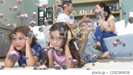 Image of macro Covid-19 cells floating over Caucasian family having a fight Image of macro Covid-19 cells floating over Caucasian family having a fight 128290626