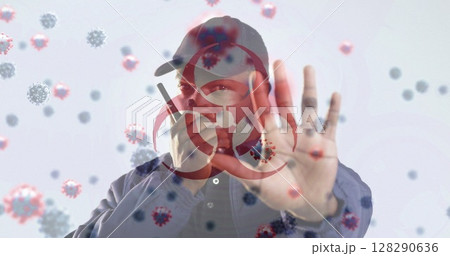 Image of a hazard sign with cells floating over biracial man using walkie talkie Image of a hazard sign with cells floating over biracial man using walkie talkie 128290636