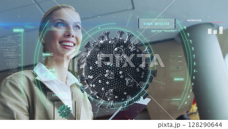 Image of floating macro Covid-19 cell over Caucasian woman holding passport at airport Image of floating macro Covid-19 cell over Caucasian woman holding passport at airport 128290644