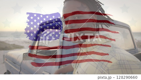 Image of american flag drawn over portrait of biracial man by a car by seaside on summer holiday Image of american flag drawn over portrait of biracial man by a car by seaside on summer holiday 128290660