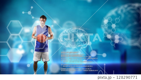 Basketball player holding ball, standing confidently with digital brain graphics Basketball player holding ball, standing confidently with digital brain graphics 128290771