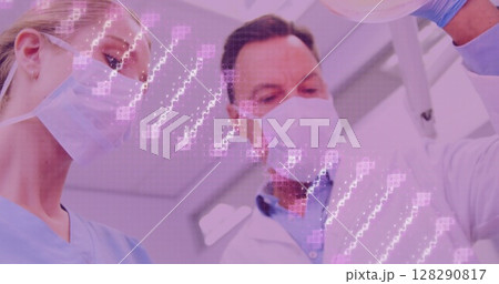 Image of dna strand spinning over male and female dentists in face masks with female patient Image of dna strand spinning over male and female dentists in face masks with female patient 128290817