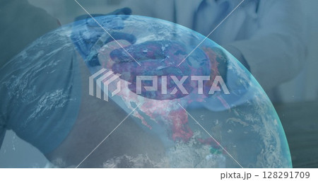 Image of globe with midsection of doctor giving vaccination to patient 128291709