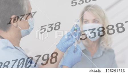 Image of rising numbers with doctor preapring vaccination for female patient 128291718