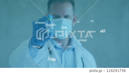 Image of statistic numbers and masked doctor holding vaccine vial 128291736