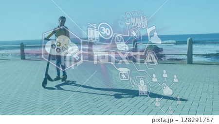 Image of technological icons over woman riding scooter on promenade by the sea Image of technological icons over woman riding scooter on promenade by the sea 128291787