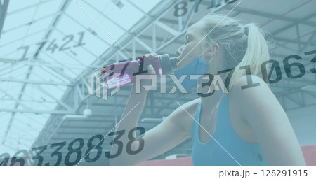 Image of numbers changing over woman in face mask drinking water taking break in exercising Image of numbers changing over woman in face mask drinking water taking break in exercising 128291915