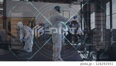 Digital interface against team of health workers spraying disinfectant at gym 128291931
