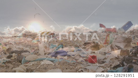 Image of clouds at sunset moving fast over waste disposal site 128291951