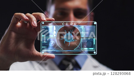 Image of male scientist holding digital screen with covid 19 cell 128293068
