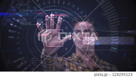 Image of man touching interactive screen with data processing and scope scanning 128293123