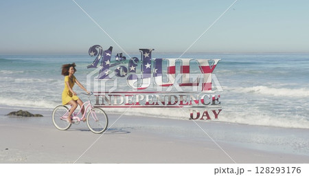 Image of 4th of july independence day text with american flag pattern and woman on bike on beach 128293176
