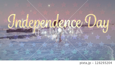 Image of independence day text with american flag pattern over couple in love on beach 128293204