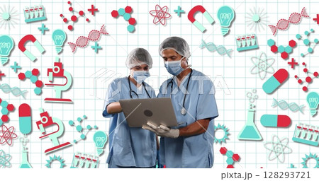 Medical professionals in scrubs using laptop, collaborating on scientific research 128293721