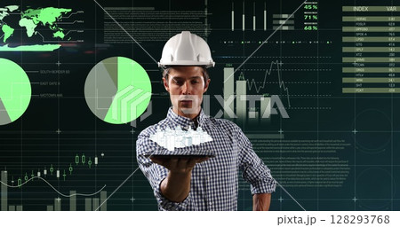 Engineer holding a tablet and viewing a 3d rotating model of a city with digital interface 128293768