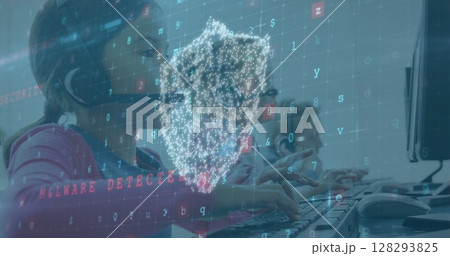 Children using computers with headset, digital security interface overlaying screen Children using computers with headset, digital security interface overlaying screen 128293825