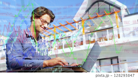 Businessman analyzing stock market data on laptop, smiling confidently outdoors 128293847