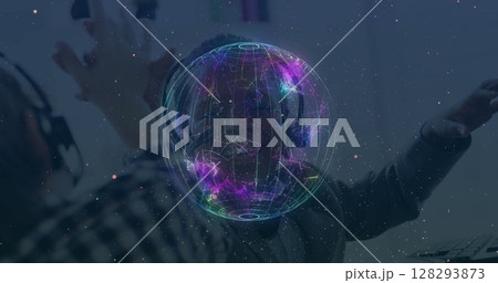 People wearing headsets interacting with digital hologram in futuristic office 128293873