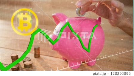 Hand placing coin in piggy bank with Bitcoin symbol and rising graph overlay 128293896
