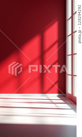 Red wall with shadow sun light from window in living room minimalist story background 128294292