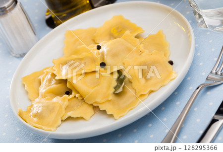 Delicious appetizing ravioli with bay leaf and black pepper 128295366